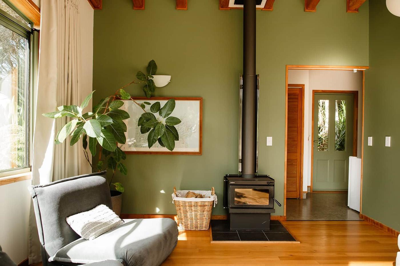 Sitting room with wood burner and armchair